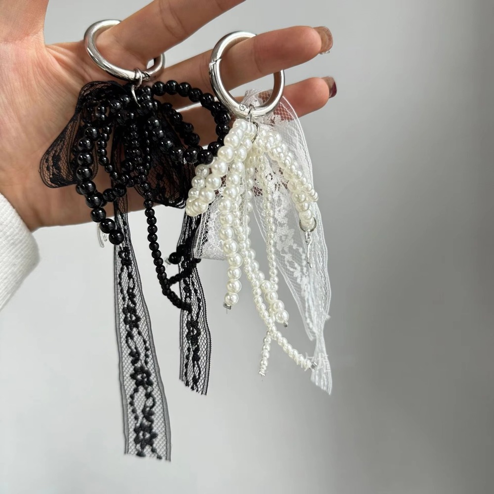 Luxury Bags White - Modischer Spitzen-Schlüsselanhänger mit Schleife in Weiß/Schwarz,